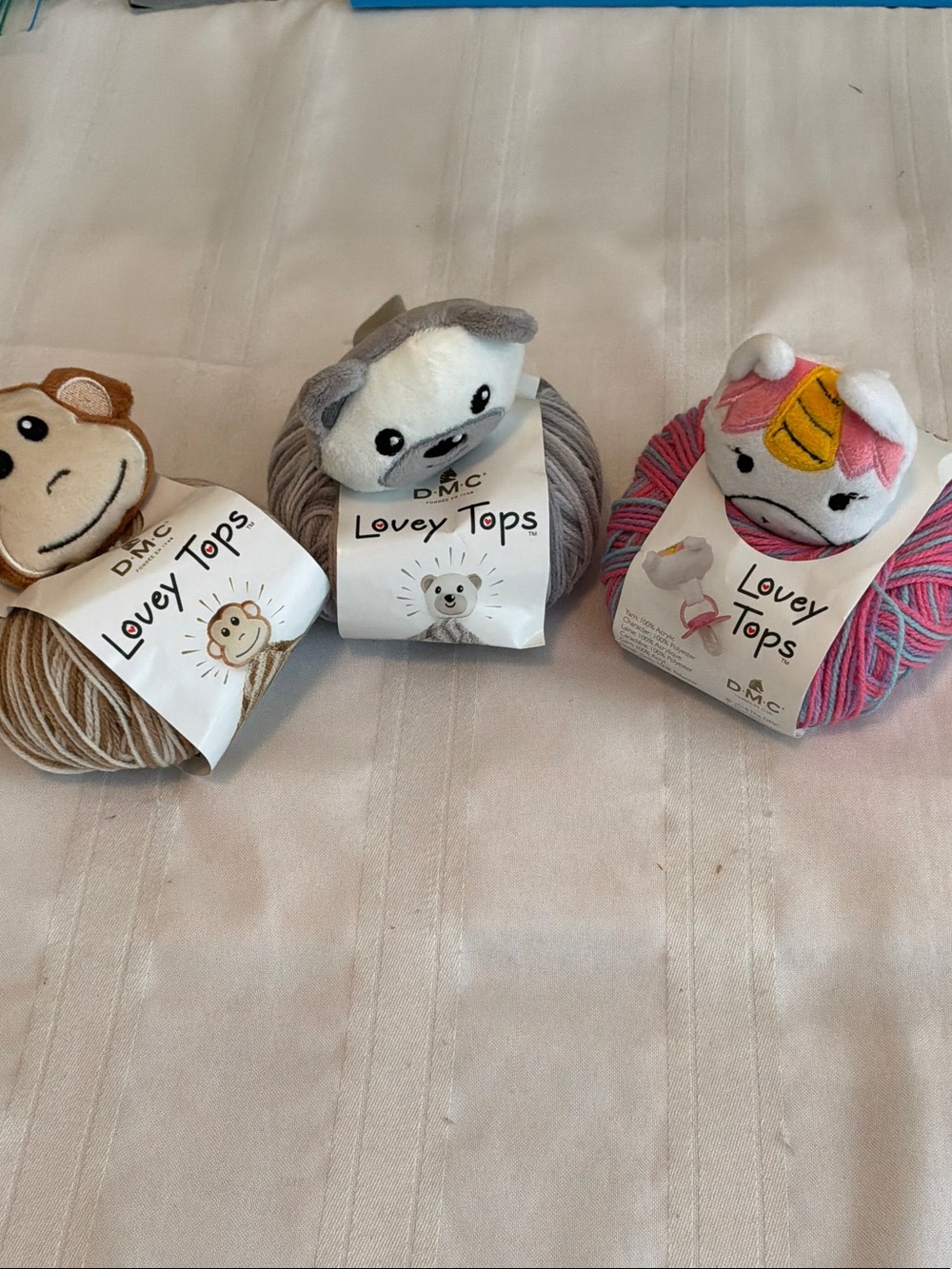 DMC Lovey Tops Plush-Topped Yarn - Gray, Brown, Pink (Set of 3) pacifier clip